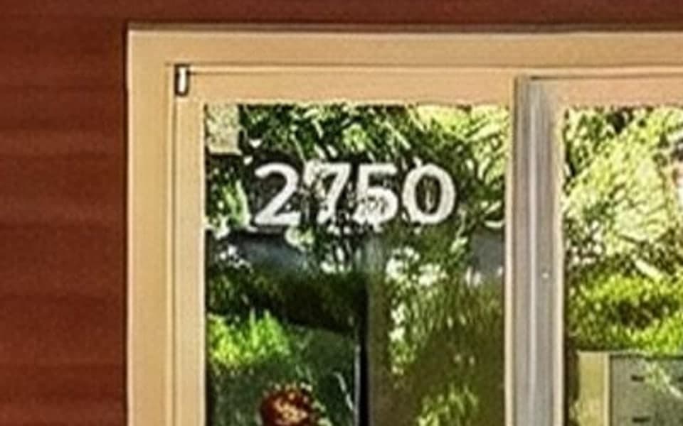 House number 2750 on a glass front door, in the original photo